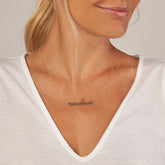 14k Yellow Gold Script Name Necklace on woman's neck